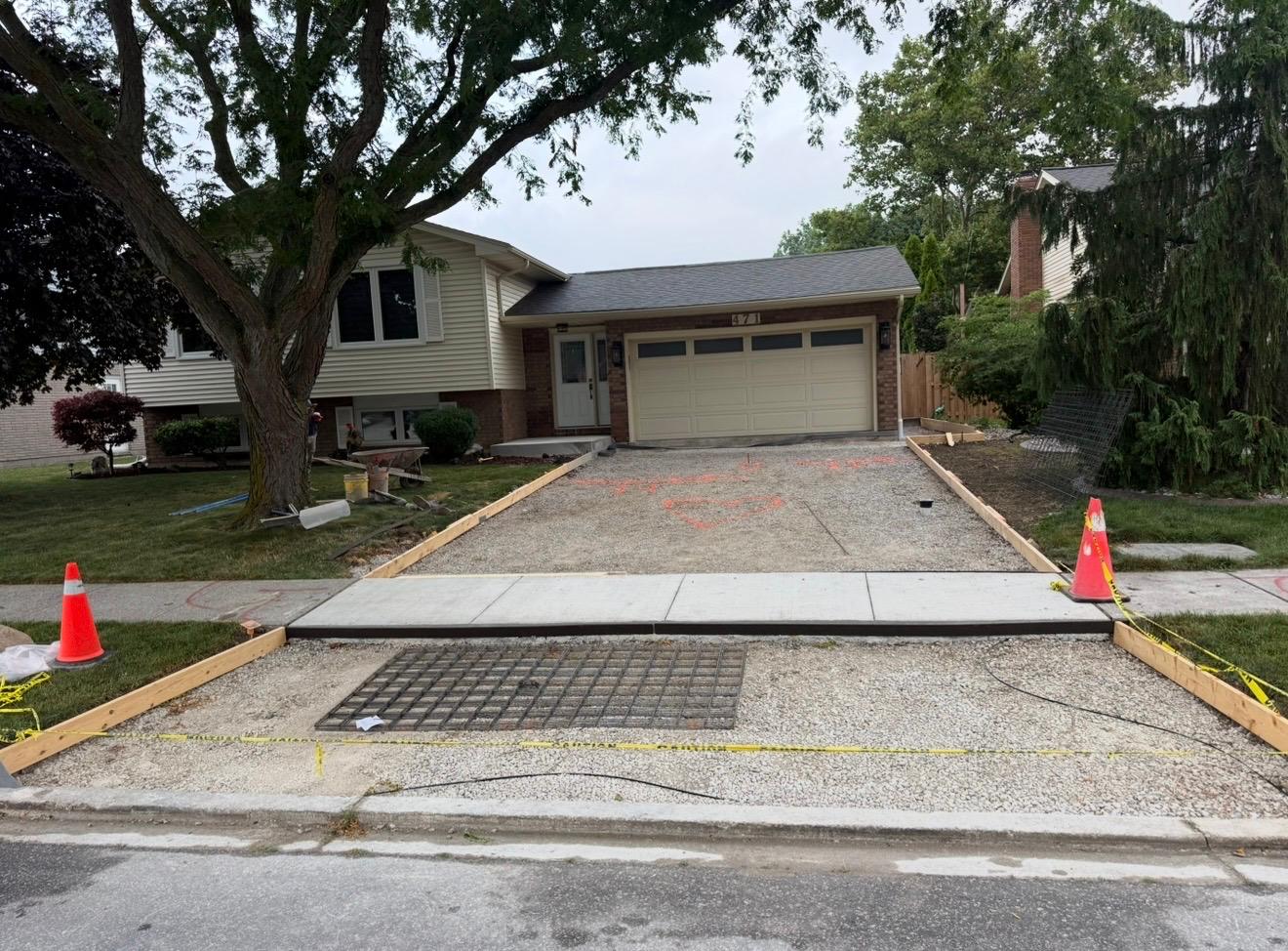 Cracked old concrete driveway before replacement in Windsor Ontario